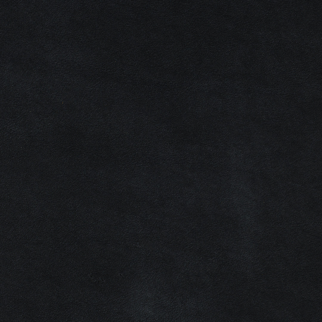 Close-up of black suede fabric texture with soft, matte finish