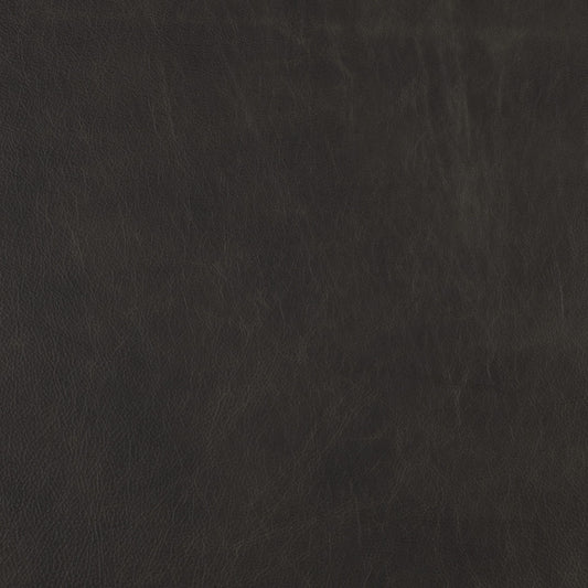Close-up of dark grey distressed leather texture with subtle wrinkles and natural grain